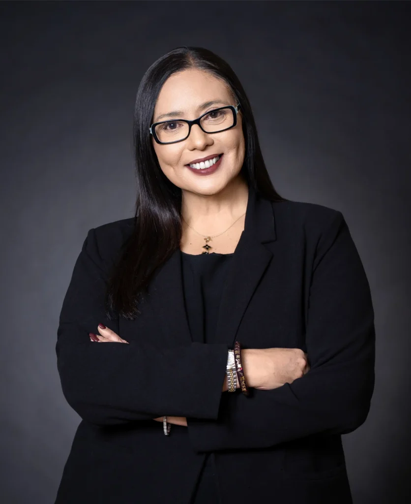 Selected professional photo of Janelle Rollo, Summit Conflict Resolution mediator, standing with arms crossed for custody mediation.